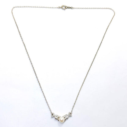 Mikimoto pearl necklace with 5.3mm pearls and silver leaf pendant on 40cm chain