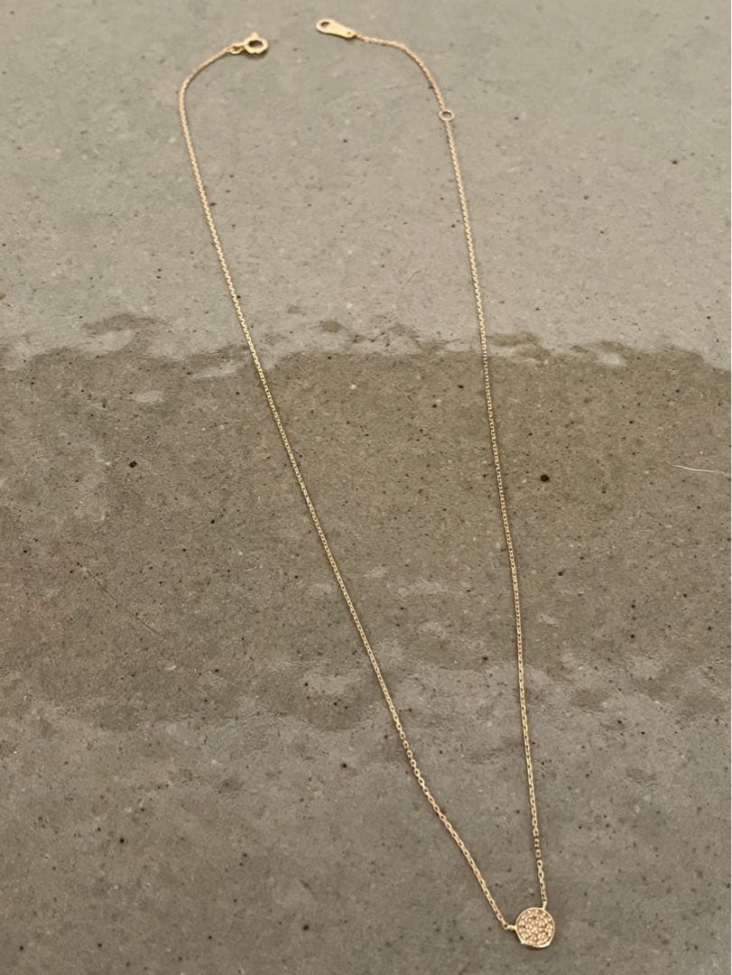 Kuro Diamond Necklace made of 18K gold featuring multiple small micro-set diamonds on a delicate chain