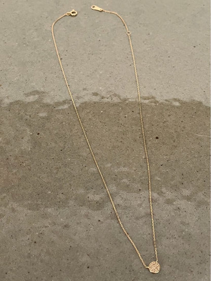 Kuro Diamond Necklace made of 18K gold featuring multiple small micro-set diamonds on a delicate chain