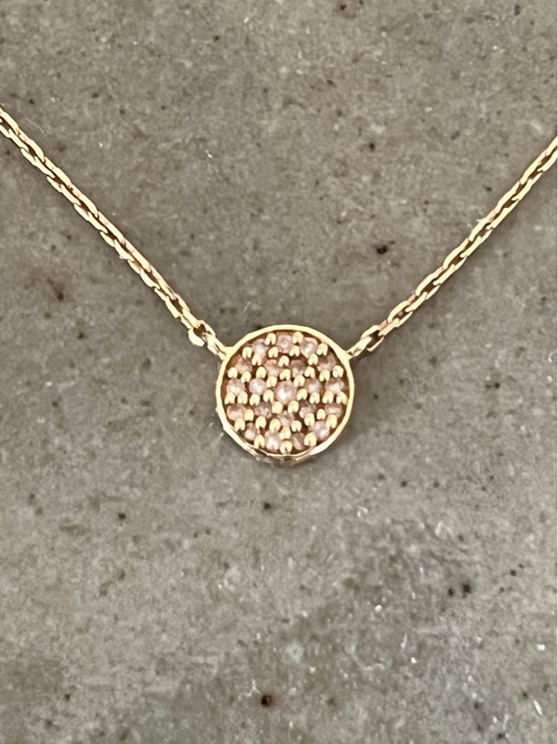 Kuro Diamond Necklace made of 18K gold featuring multiple small micro-set diamonds on a delicate chain