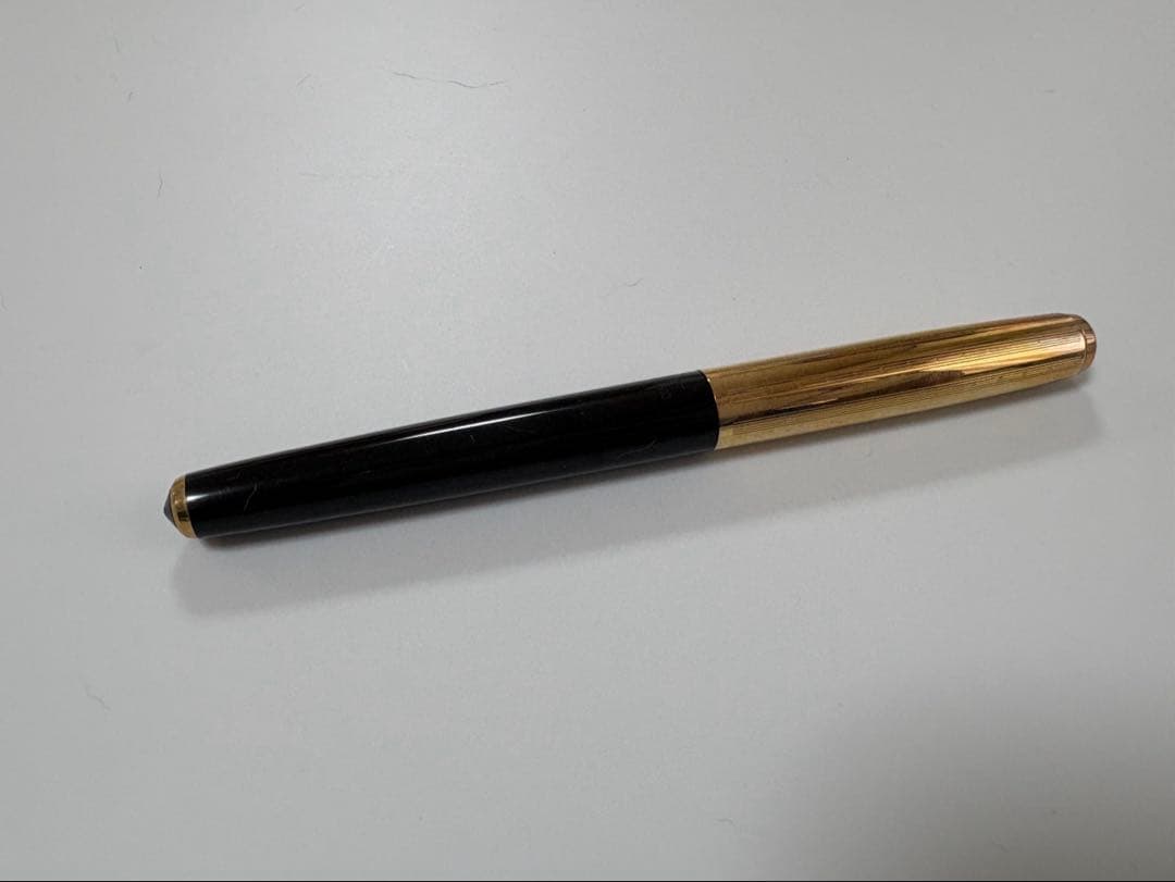 Vintage Pilot Super 300 fountain pen with 14K nib and accompanying case shown on white background