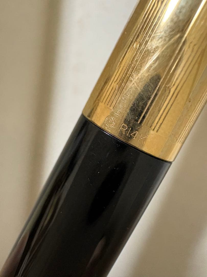 Vintage Pilot Super 300 fountain pen with 14K nib and accompanying case shown on white background