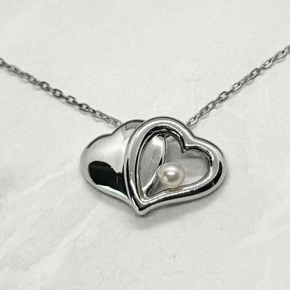 Mikimoto Akoya Pearl single pearl necklace pendant in silver with double heart design on 40 cm chain