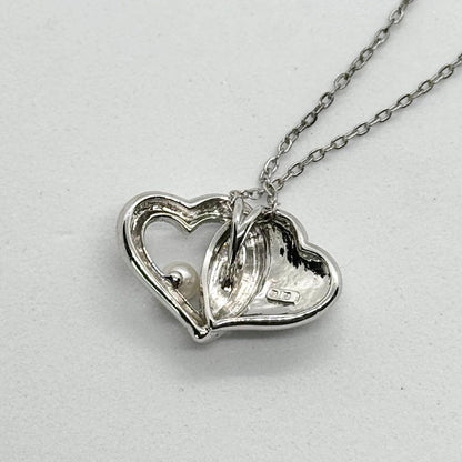 Mikimoto Akoya Pearl single pearl necklace pendant in silver with double heart design on 40 cm chain