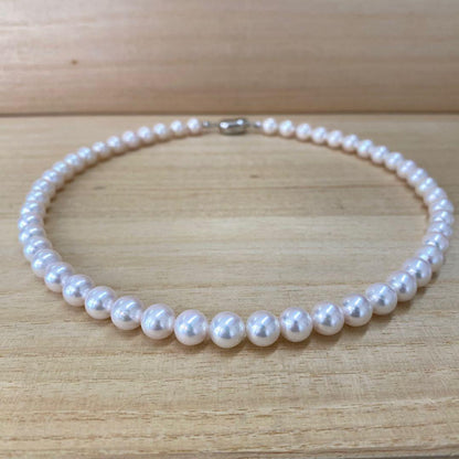 Akoya pearl necklace with 50 iridescent white pearls sized 8.0-8.5mm on silver clasp