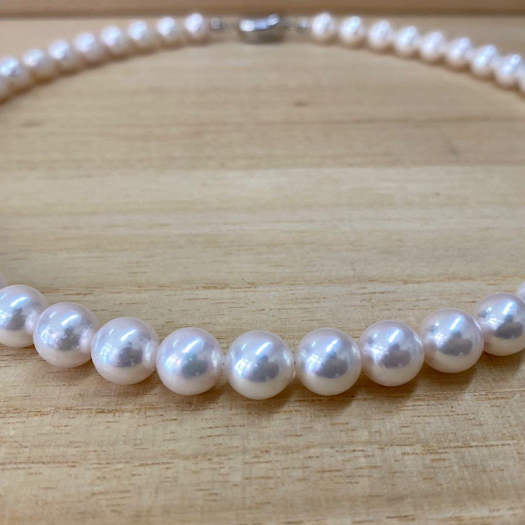 Akoya pearl necklace with 50 iridescent white pearls sized 8.0-8.5mm on silver clasp