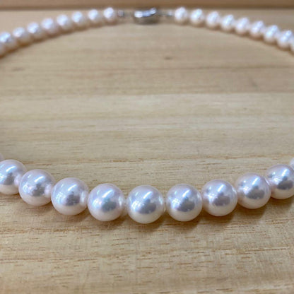 Akoya pearl necklace with 50 iridescent white pearls sized 8.0-8.5mm on silver clasp