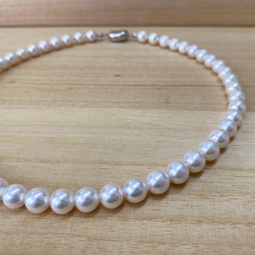Akoya pearl necklace with 50 iridescent white pearls sized 8.0-8.5mm on silver clasp