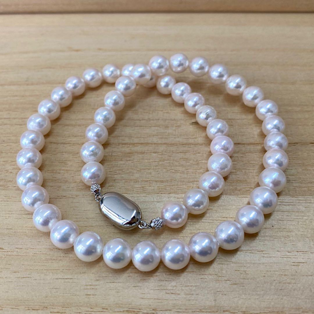Akoya pearl necklace with 50 iridescent white pearls sized 8.0-8.5mm on silver clasp