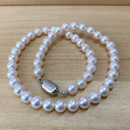 Akoya pearl necklace with 50 iridescent white pearls sized 8.0-8.5mm on silver clasp