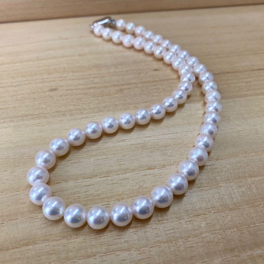 Akoya pearl necklace with 50 iridescent white pearls sized 8.0-8.5mm on silver clasp