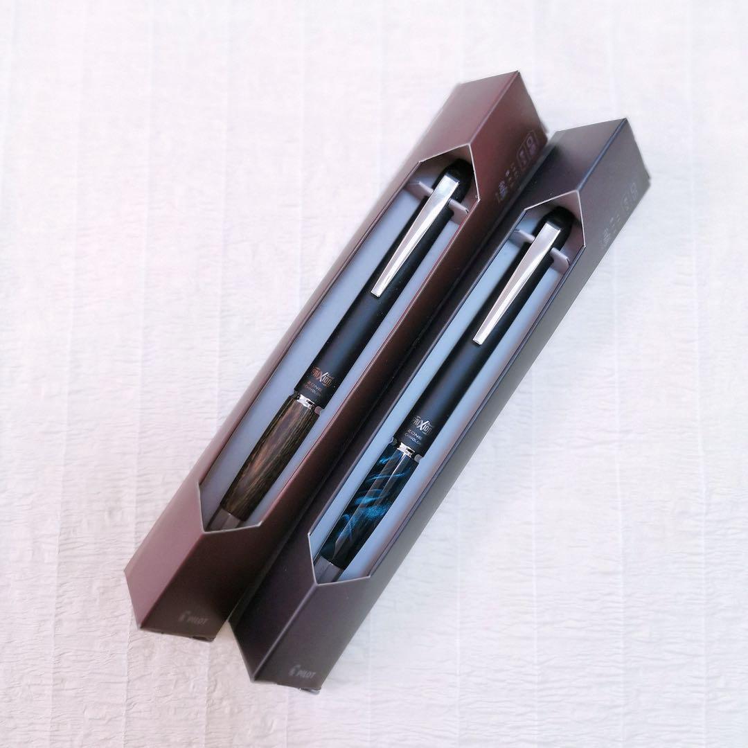 Frixion Ball Knock Zone pen set with click mechanism, 0.5mm tip, black ink, and marble grip in green and brown colors
