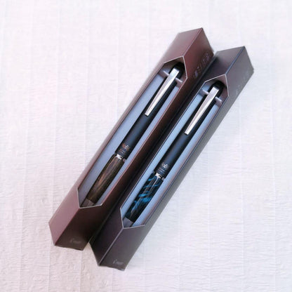 Frixion Ball Knock Zone pen set with click mechanism, 0.5mm tip, black ink, and marble grip in green and brown colors