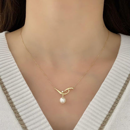 Mikimoto K18 yellow gold Akoya pearl necklace with 7.4mm pearl and diamond pendant on 42cm chain