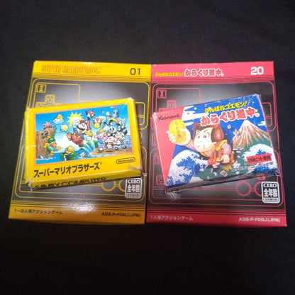 Super Mario Brothers and Kurakuri Dōchū Game Boy Advance yellow and red cartridges with games 01 and 20