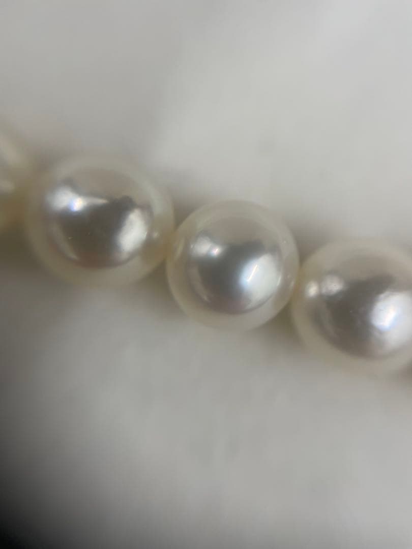 TASAKI Pearl Necklace with 6 mm pearls and 26 cm length displayed on white background
