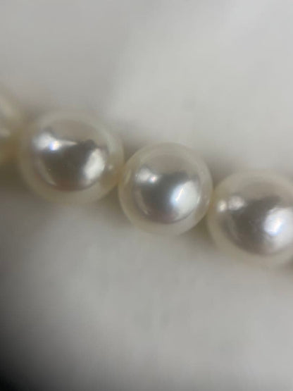 TASAKI Pearl Necklace with 6 mm pearls and 26 cm length displayed on white background