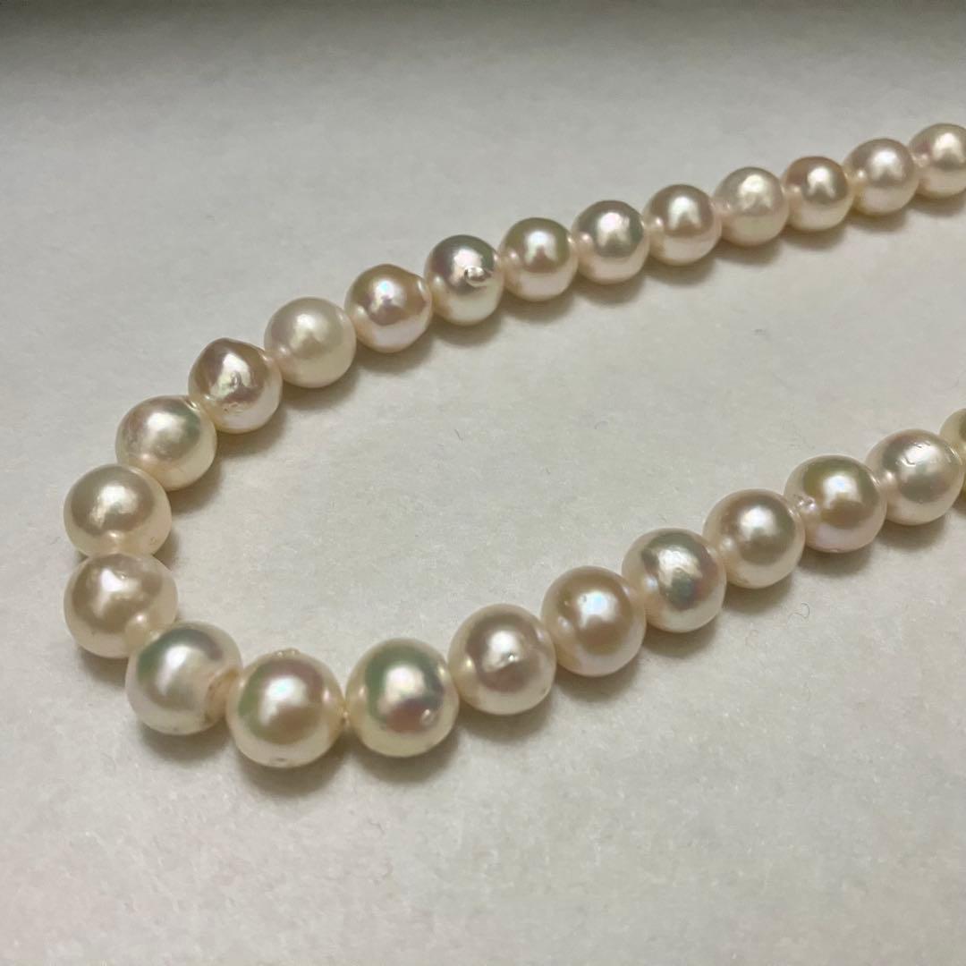 Akoya pearl necklace with large 9-9.5mm semi-round pearls and flower motif clasp