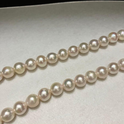Akoya pearl necklace with large 9-9.5mm semi-round pearls and flower motif clasp
