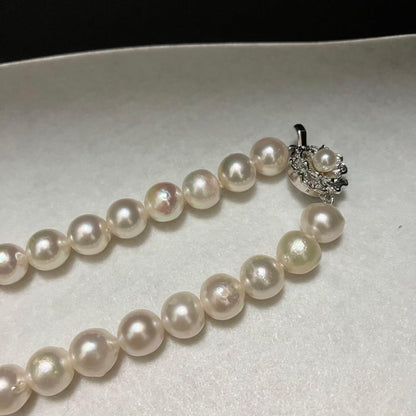Akoya pearl necklace with large 9-9.5mm semi-round pearls and flower motif clasp