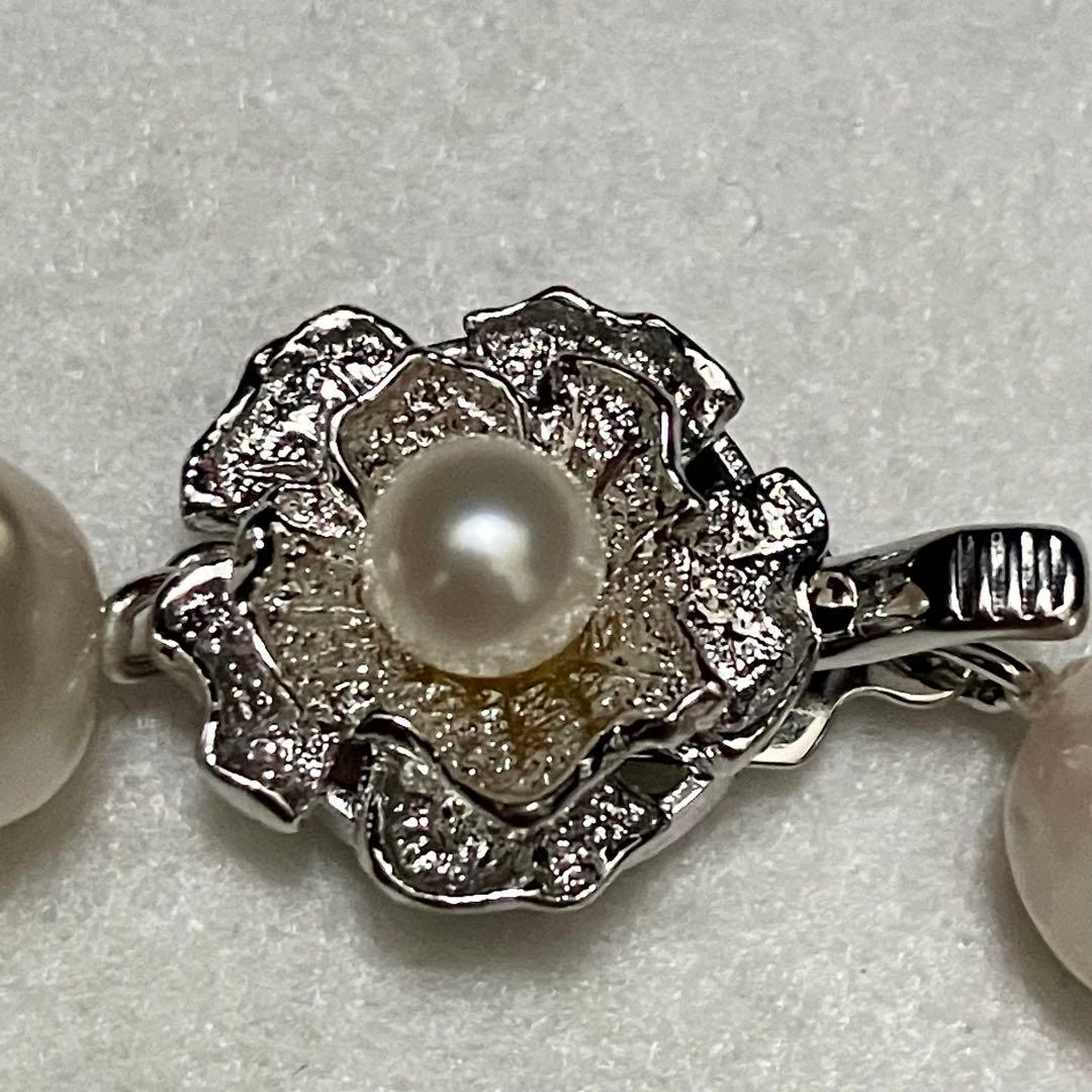 Akoya pearl necklace with large 9-9.5mm semi-round pearls and flower motif clasp