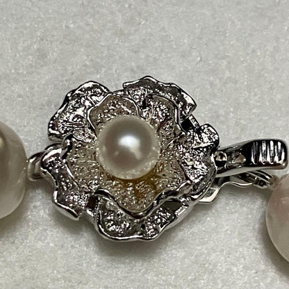 Akoya pearl necklace with large 9-9.5mm semi-round pearls and flower motif clasp