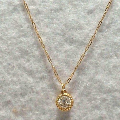 Agete K18 diamond pendant necklace featuring 0.15ct diamond on a delicate link chain