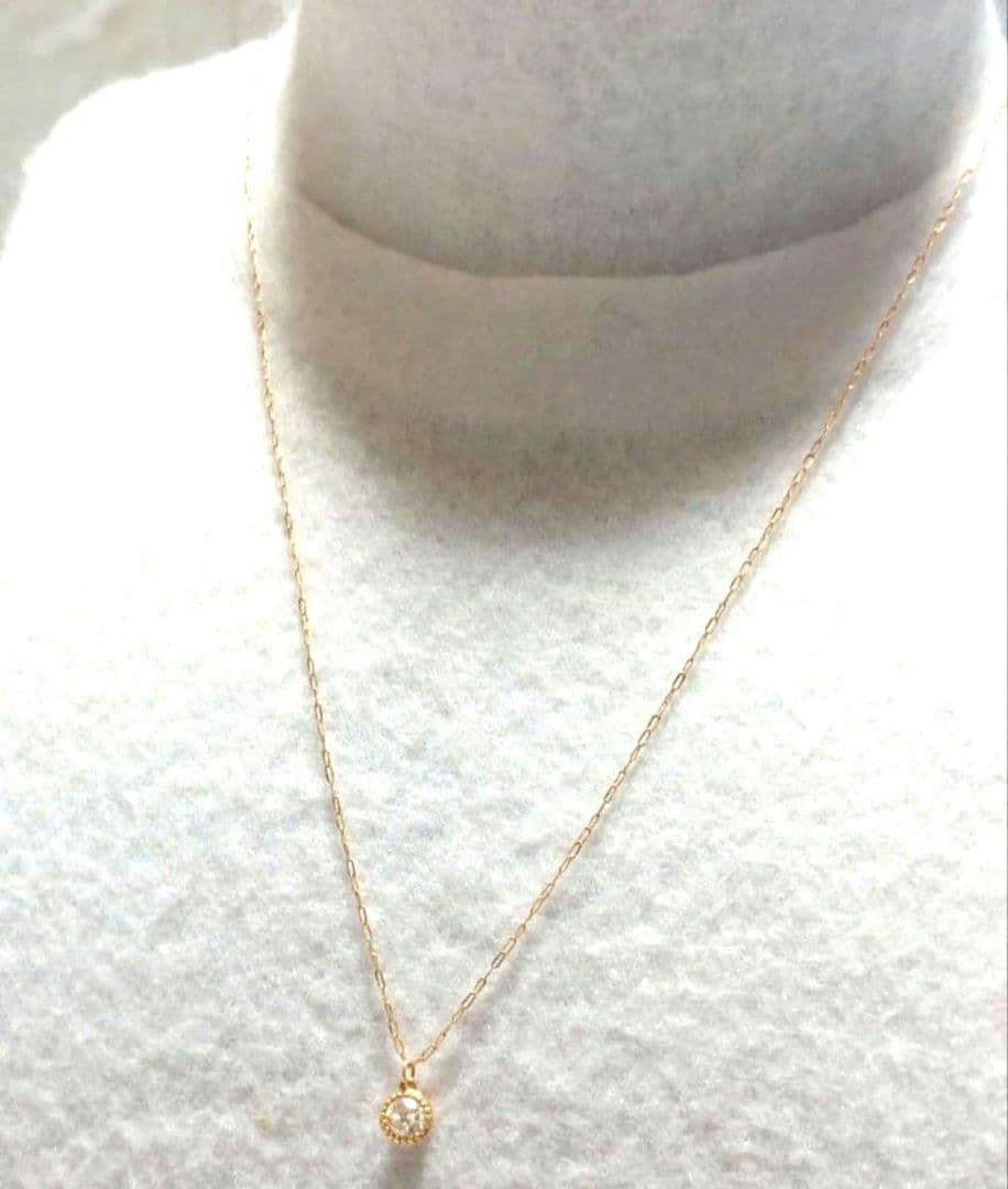 Agete K18 diamond pendant necklace featuring 0.15ct diamond on a delicate link chain