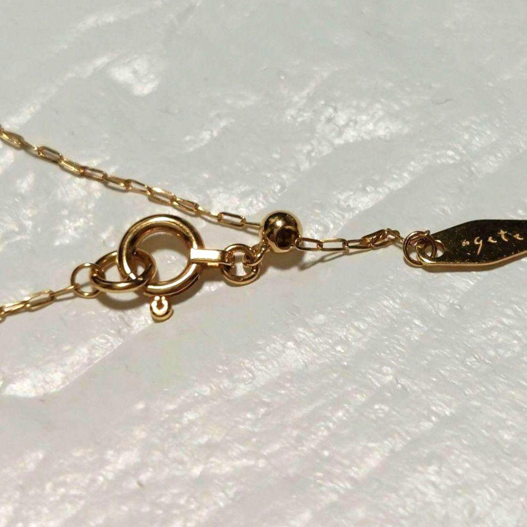 Agete K18 diamond pendant necklace featuring 0.15ct diamond on a delicate link chain