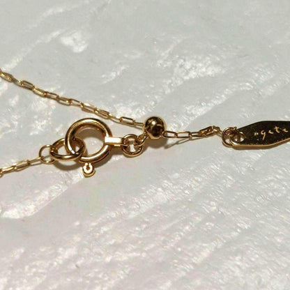 Agete K18 diamond pendant necklace featuring 0.15ct diamond on a delicate link chain
