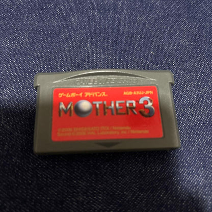 Mother 3 Nintendo software with paper tray, instruction manual, and outer box in used condition
