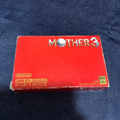 Mother 3 Nintendo software with paper tray, instruction manual, and outer box in used condition