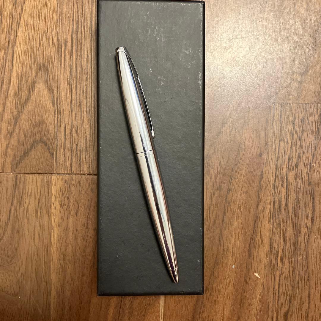 New Cross ballpoint pen with rotating tip and black ink featuring a small English cursive company name