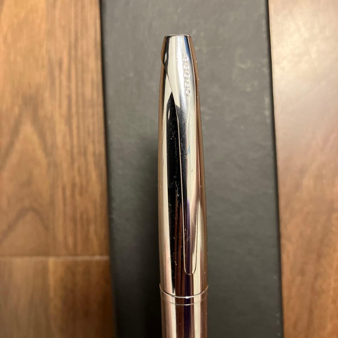 New Cross ballpoint pen with rotating tip and black ink featuring a small English cursive company name