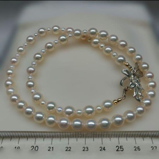 Honmei pearl necklace about 56cm long with 22 small 5mm and larger 8.2mm Akoya pearls
