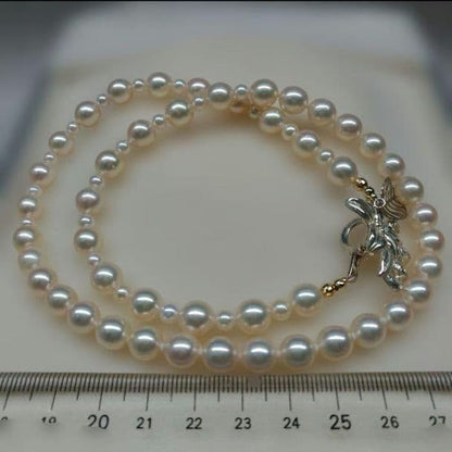 Honmei pearl necklace about 56cm long with 22 small 5mm and larger 8.2mm Akoya pearls