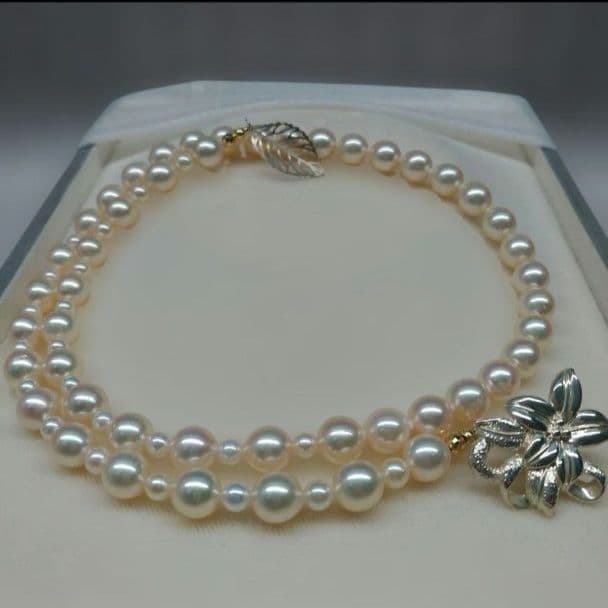 Honmei pearl necklace about 56cm long with 22 small 5mm and larger 8.2mm Akoya pearls
