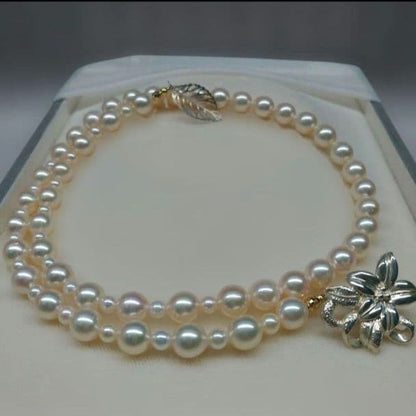 Honmei pearl necklace about 56cm long with 22 small 5mm and larger 8.2mm Akoya pearls