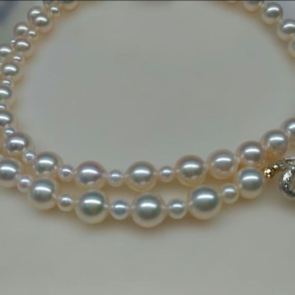 Honmei pearl necklace about 56cm long with 22 small 5mm and larger 8.2mm Akoya pearls