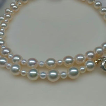 Honmei pearl necklace about 56cm long with 22 small 5mm and larger 8.2mm Akoya pearls