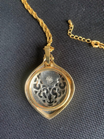 MIKIMOTO gold tone pearl pendant with attached magnifying glass showing no scratches or discoloration