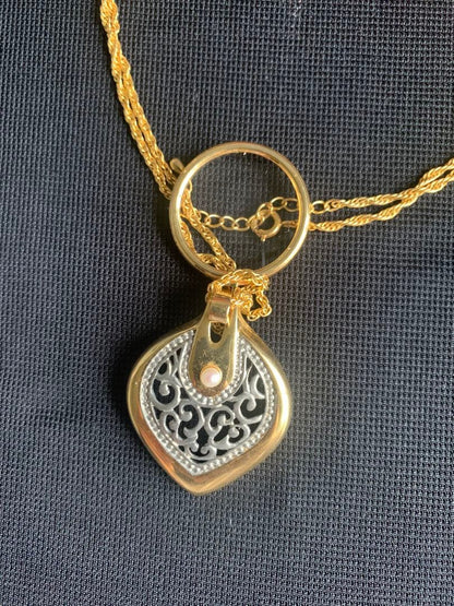 MIKIMOTO gold tone pearl pendant with attached magnifying glass showing no scratches or discoloration