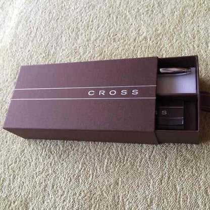 New unused Cross Ballpoint Pen in its original box with sleek silver and black design