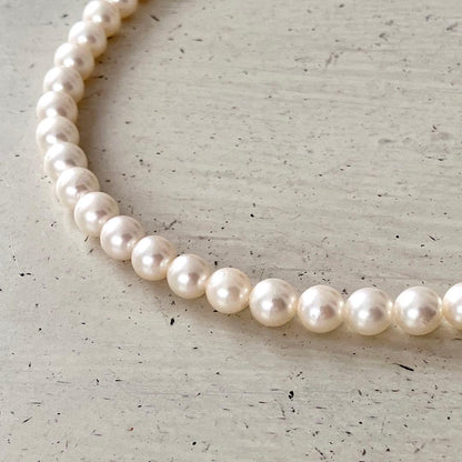 Akoya pearl necklace in silver with 6mm pearls and 44cm length displayed on white background