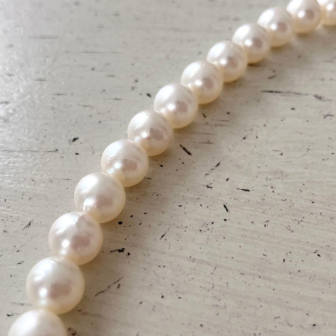 Akoya pearl necklace in silver with 6mm pearls and 44cm length displayed on white background