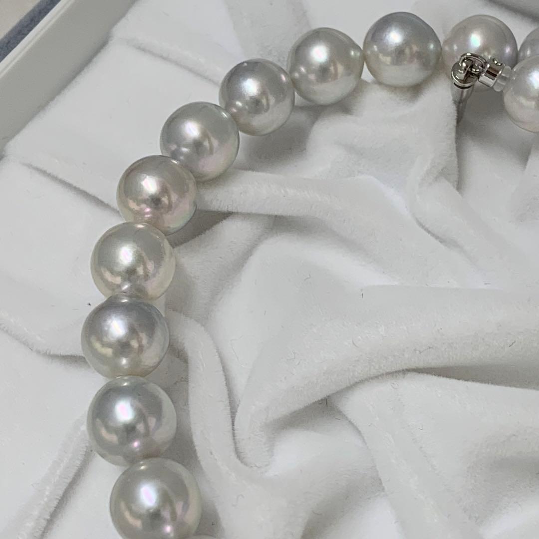 Natural gray Akoya pearl necklace 9-9.5mm with silver clasp on white background
