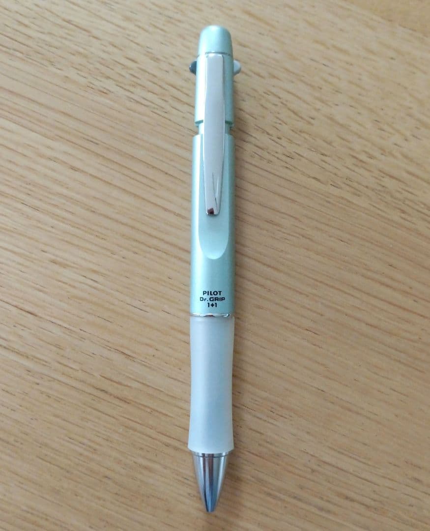Pilot Dr. Grip 1+1 multi-function pen with metallic light blue barrel and 0.5mm black ballpoint tip