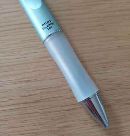 Pilot Dr. Grip 1+1 multi-function pen with metallic light blue barrel and 0.5mm black ballpoint tip