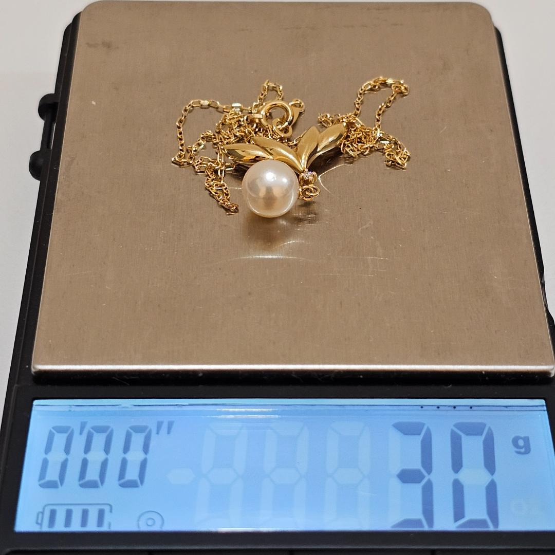 Mikimoto pearl diamond necklace in 18K yellow gold with 40cm chain featuring a 7.6mm pearl and diamond accents