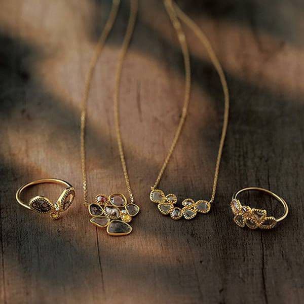 agete K14 gold necklace with a slice diamond pendant on a white background